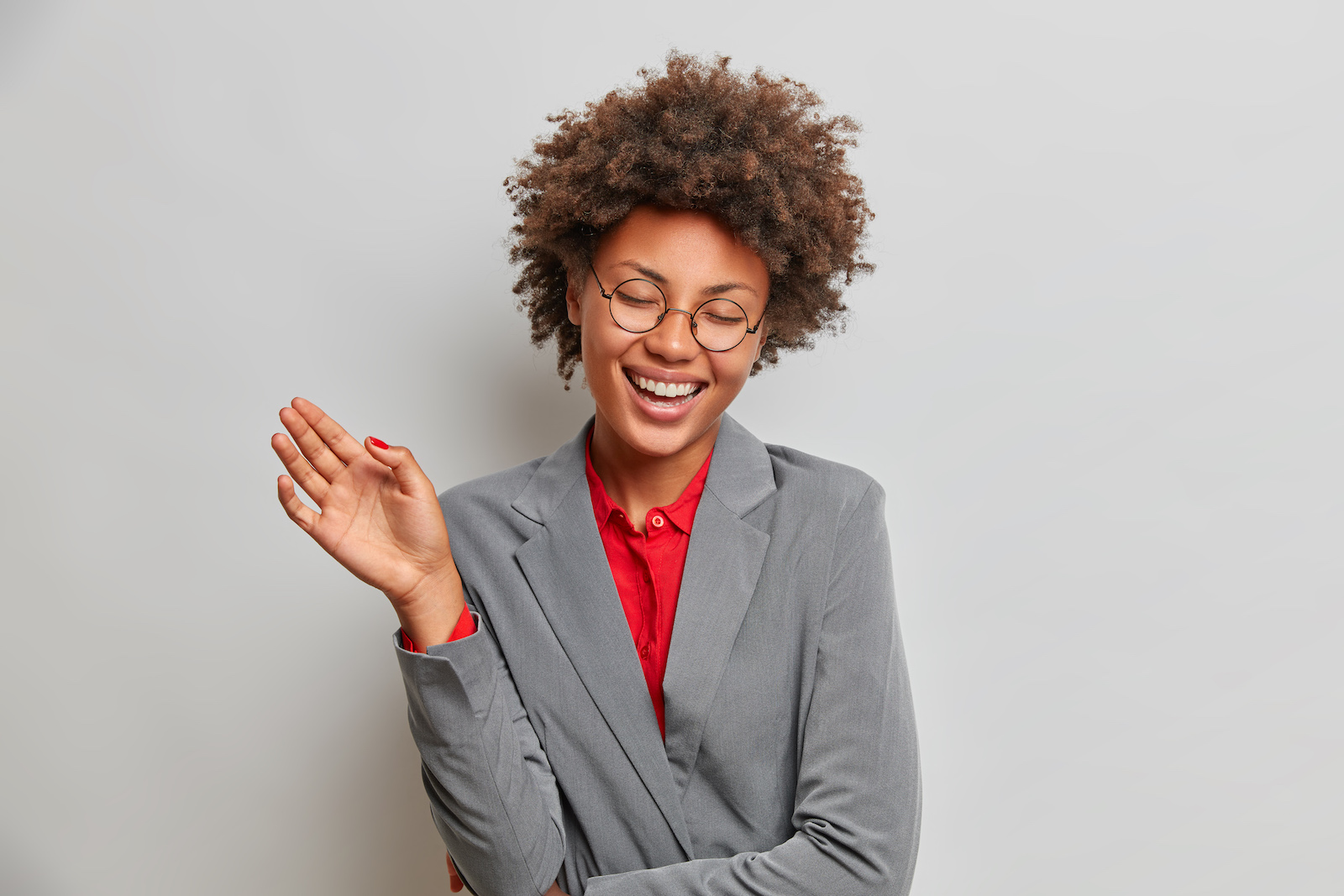 overjoyed-successful-female-entrepreneur-laughs-fr-6B29NRG